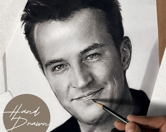 May include: A black and white hand-drawn portrait of a man with short dark hair. The man is smiling and looking to the right. The artist is using a pencil to add details to the drawing.