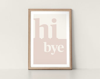 May include: A framed print with a pink background and white text that reads "hi bye".