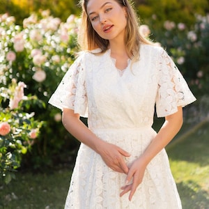 lace floral wedding dress a line, simple wrap wedding dress flutter sleeves, boho wedding dress non traditional, outdoor garden ceremony