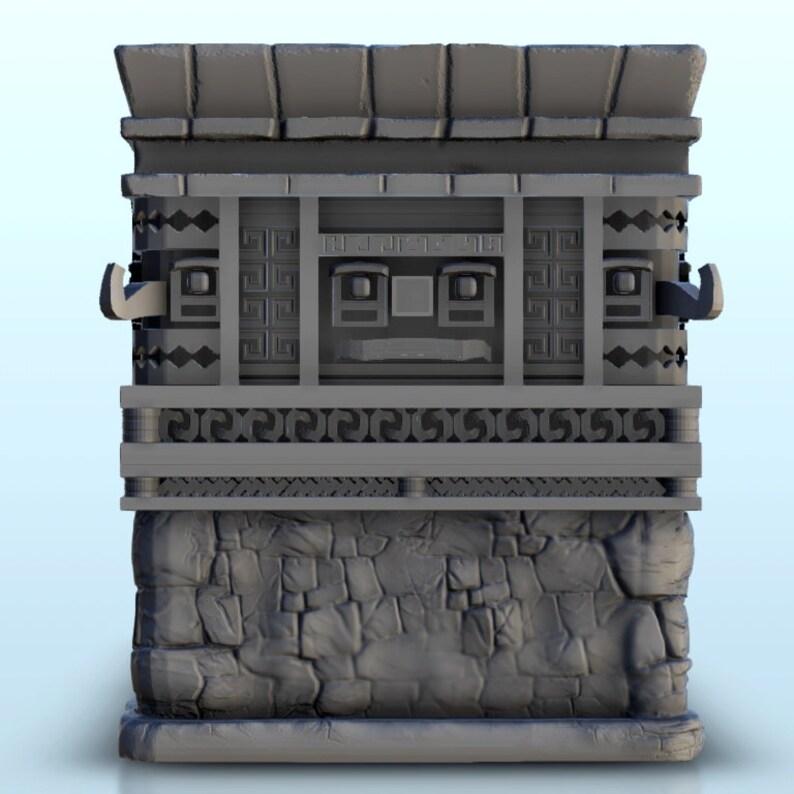 May include: A gray 3D printed model of a stone building with a roof and a face carved into the front. The building has a stone base and a decorative frieze.