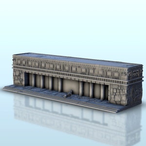 May include: A gray stone building with a flat roof and columns. The building has a decorative facade with a repeating pattern of squares and rectangles.