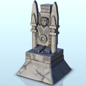 May include: A gray stone statue of a figure with a circular design on its chest, standing on a platform with a textured surface.