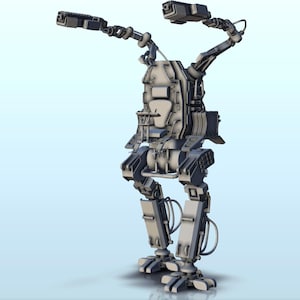 May include: A gray, articulated, robotic exoskeleton with two arms and legs. The arms are raised and have guns attached to the ends. The legs are bent at the knees and the feet are flat on the ground.