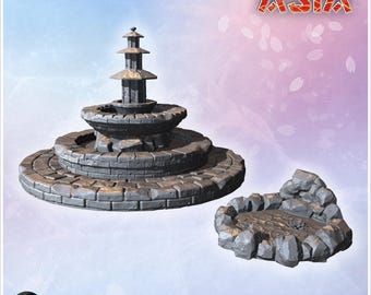Large fountain with layered circular stone basins and adjacent decorative pond surrounded by rocks (3)