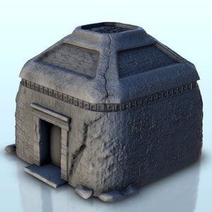 May include: A gray, stone-like structure with a rectangular base and a sloped roof. The building has a small doorway and decorative trim around the top. The exterior has a rough, textured appearance, suggesting an ancient or weathered design.