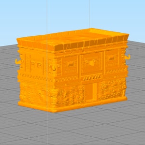 May include: A 3D printed model of a small, orange building with a flat roof and detailed stonework. The building has a door and windows, and the walls are decorated with intricate patterns.