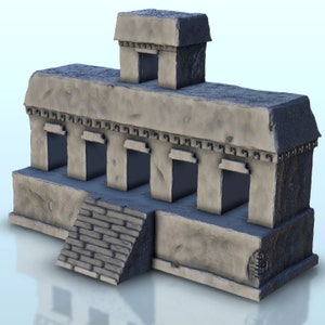 May include: A gray stone model of an ancient Mayan temple with a stepped entrance and multiple doorways. The temple has a small tower on top.