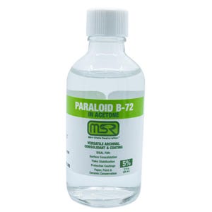 May include: A clear glass bottle with a white cap, containing a liquid. The label reads "PARALOID B-72 IN ACETONE" with "MSR" logo. It is a versatile archival consolidant and coating, with a 5% concentration and 2 fl oz (59 mL).