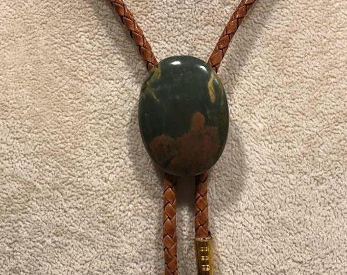 Red Creek Jasper Bolo Tie on Light Saddle Tan Braided Leather with Brass Tips