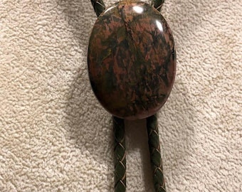 Red Creek Jasper Bolo Tie on OLIVE GREEN Braided Leather with Brass Tips