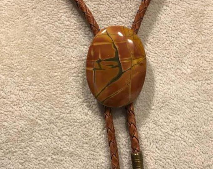 Red Creek Jasper Bolo Tie on Light Saddle Tan Braided Leather with Brass Tips