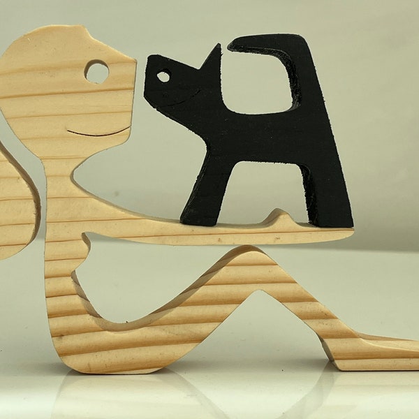 Woman with ponytail and a Black Cat handmade wooden ornament sculpture carving