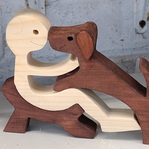 Funky people, man in chair with dog . Handmade wooden dog ornament