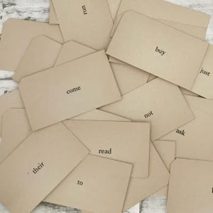 Vintage word flash cards from the 1950s. One dozen (12) randomly chosen cards, 2 inches by 3 1/2 inches by Dolch.  Blank on one side.