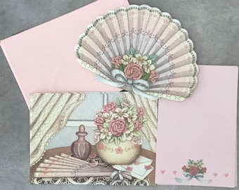 Vintage Victorian rose stationery set from the 1980s. 18 sheets of pink paper, 2 die cut fan cards, 7 pink envelopes, and 6 post cards.