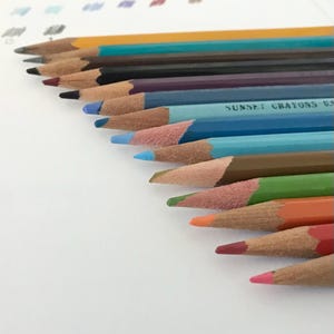 Vintage mixed lot of 12 colored pencils and 2 drawing pencils. Includes Venus, Tombow, Berol, Mitsubishi, Eberhard Faber, and more.