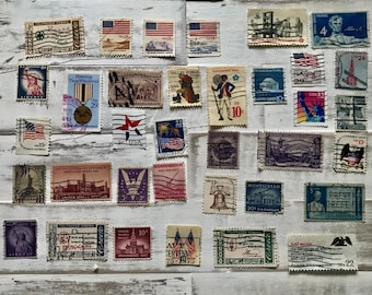 Vintage curated set of 35 used United States postage stamps commemorating America's founding and history.