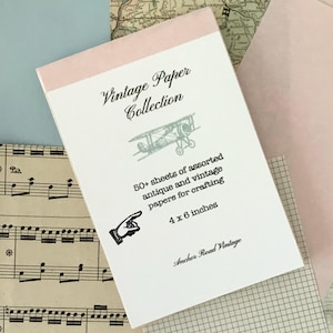 May include: A notepad from the Vintage Paper Collection with a light pink top edge. The cover features an illustration of a biplane and the text "50+ sheets of assorted antique and vintage papers for crafting, 4 x 6 inches".