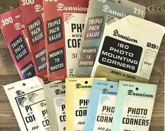 Vintage Dennison photo corners. Lot of 10 partial packages in green, gold, silver, red, blue, white, and cream. For photos and collage.