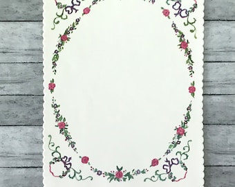 Vintage flowered stationery with scalloped edges and a wreath of purple and pink flowers.  For letter writing and more. About 6 by 8 inches.