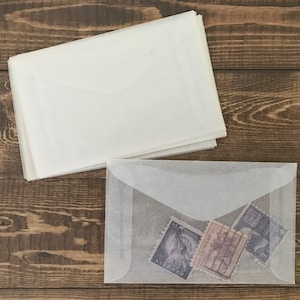 Size 2 vintage glassine envelopes for stamp and ephemera storage, paper crafts, and more. Fits business cards! One dozen small envelopes.