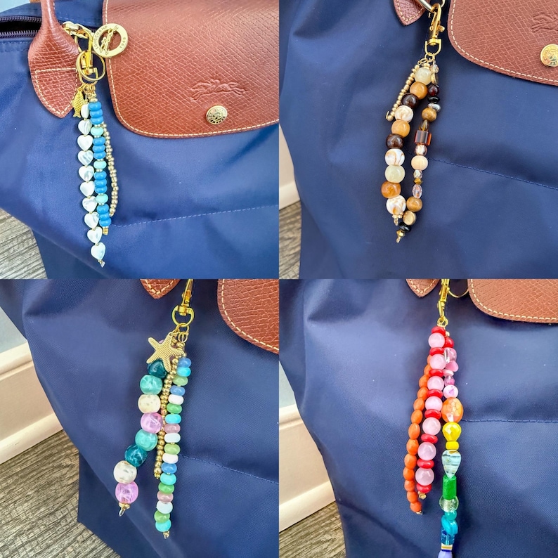 May include: Four beaded keychain charms in various colors, hanging from gold-colored clasps. One charm features blue and white heart-shaped beads, another has brown and tan beads, a third has a starfish charm, and the last has rainbow-colored beads.