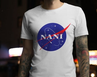 May include: White t-shirt with a blue and red NASA-inspired logo that says "NANI" in white letters.