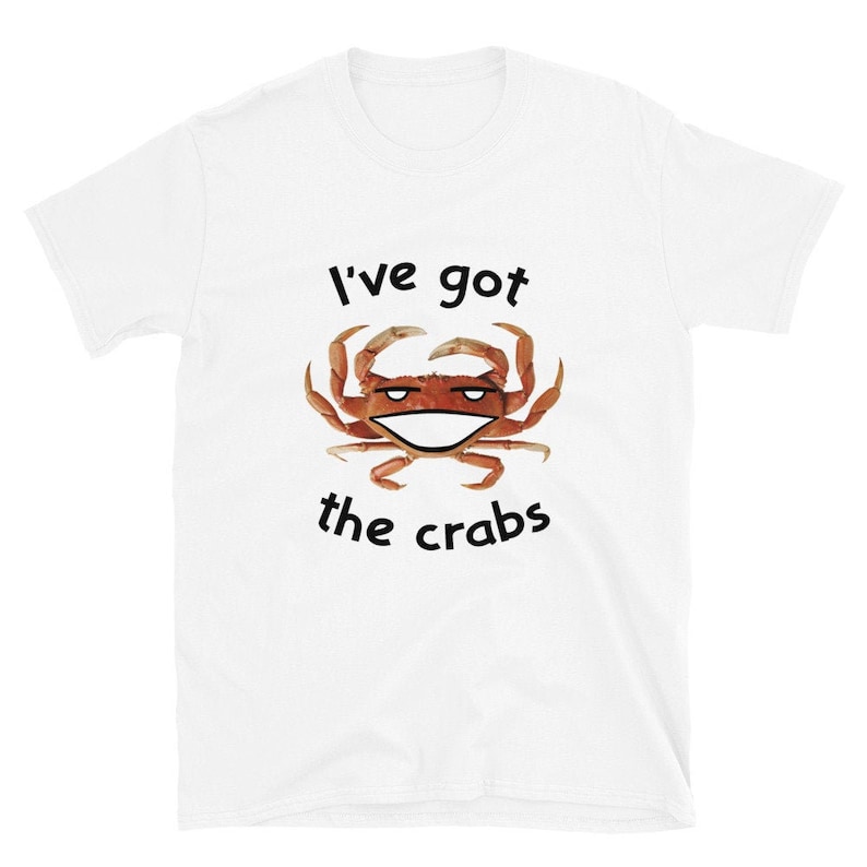 May include: White t-shirt with a smiling crab graphic and the text "I've got the crabs".