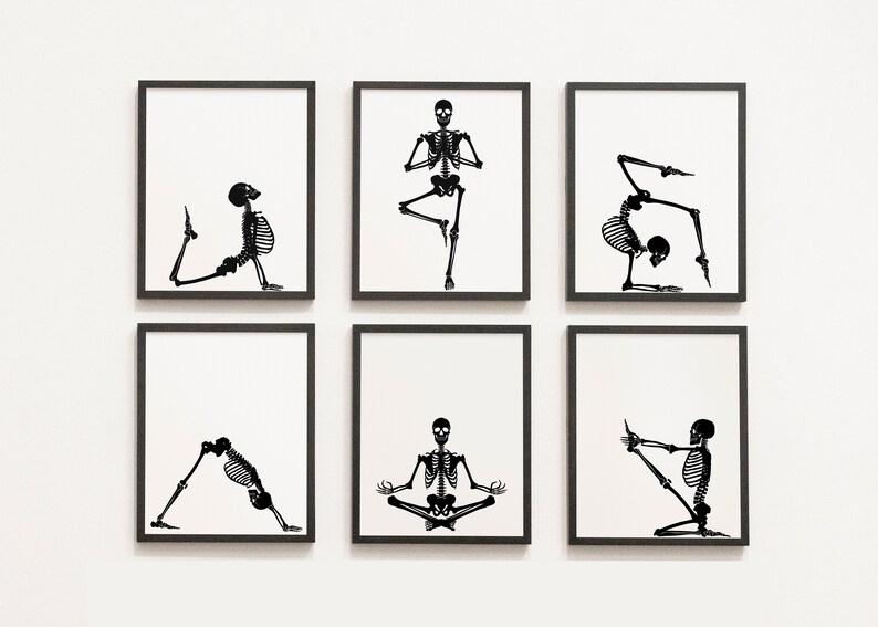 May include: Six framed art prints featuring black skeleton illustrations in various yoga poses against a white background. The prints are displayed in a grid, showcasing the skeleton figures in different asanas, including balancing, stretching, and seated positions.