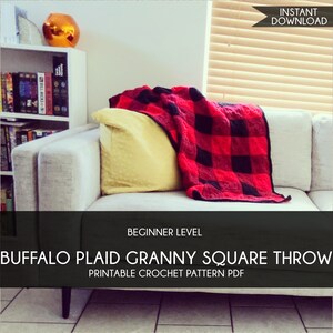 May include: A red and black buffalo plaid granny square throw blanket draped over a light-colored sofa. A yellow pillow rests against the sofa's arm. The image includes text that reads "Beginner Level" and "Buffalo Plaid Granny Square Throw Printable Crochet Pattern PDF."