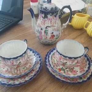 eggshell porcelain teapot and two &#39;dainty trios&#39; from Japan