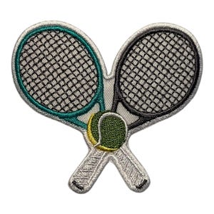 May include: Embroidered patch featuring two crossed tennis rackets and a tennis ball. The rackets have black netting and teal and black frames. The tennis ball is green and yellow. The patch is on a white background.