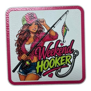 May include: A square coaster with a pink border features a cartoon illustration of a woman holding a fishing rod. The text "Weekend Hooker" is displayed with a fishing hook graphic. The woman is wearing a pink shirt, denim shorts, and a pink hat.