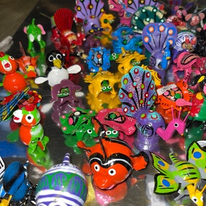 Lot of 100 Bobble heads hand painted and handmade Birds pigs fish animals from movies so cute.