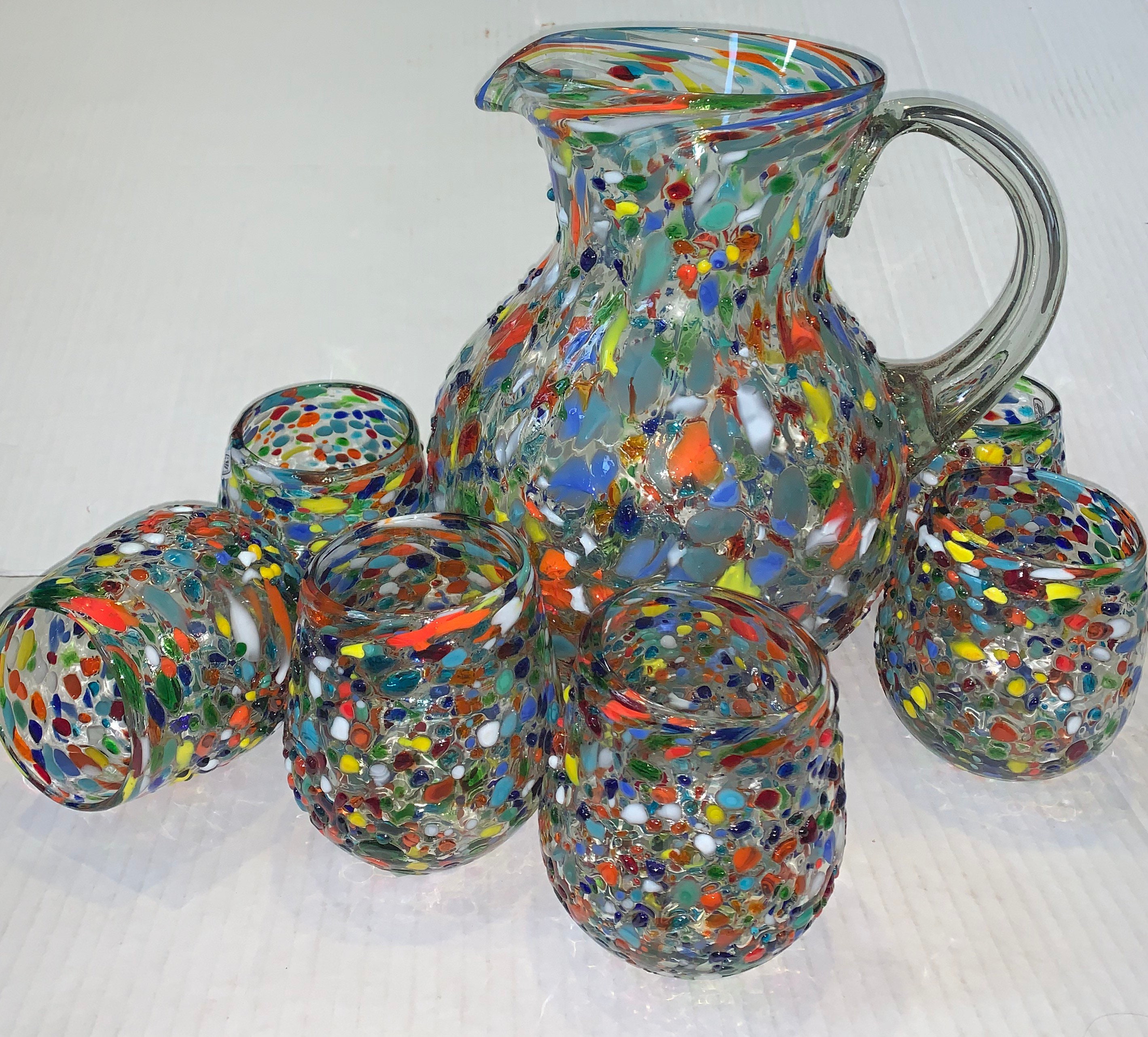 Pitcher set of  7 piece set Pebble and 6 stemless wine glasses pebble beautiful hand blown elegant with a touch of class.