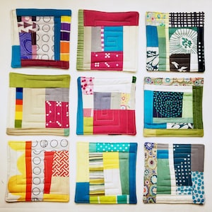 May include: Nine colorful fabric coasters with geometric patterns. Each coaster features a different combination of colors and patterns, including red, blue, green, yellow, and white.