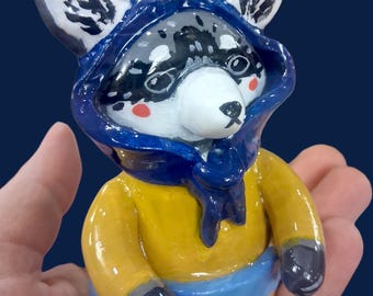 Figura de arcilla de Louise el mapache