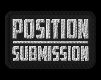 May include: Black rectangular patch with white embroidered text. The text reads "POSITION" above a horizontal line, and "SUBMISSION" below it. The patch has a black border and a textured appearance.