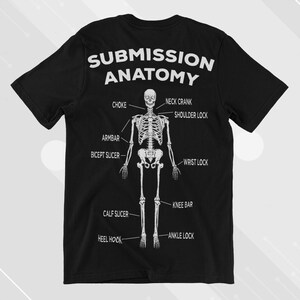 May include: A black t-shirt featuring a white skeleton graphic illustrating various submission holds in Brazilian Jiu-Jitsu. The text "Submission Anatomy" is printed above the skeleton.
