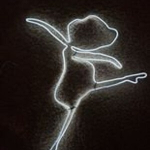 May include: White neon light sculpture of a dancer in a pose with one leg extended. The sculpture is made of a single continuous line of neon light.