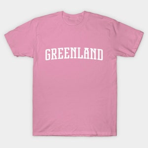 May include: A pink t-shirt with the word "GREENLAND" printed in white on the front.