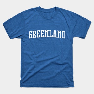 May include: A royal blue t-shirt with the word "GREENLAND" printed in white in an arched font.