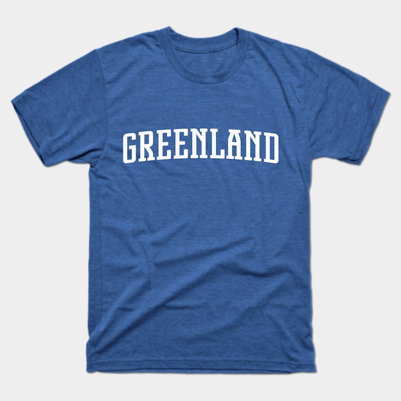 May include: A royal blue t-shirt with the word "GREENLAND" printed in white in an arched font.