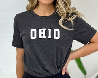 May include: A dark gray t-shirt with the word "OHIO" printed in white on the front.