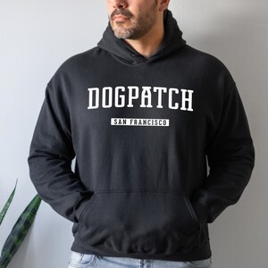 May include: Black hooded sweatshirt with white text that reads "DOGPATCH SAN FRANCISCO".