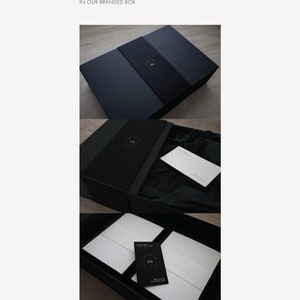 Puede incluir: Una caja rectangular negra con una funda de marca que presenta un logotipo de letra m blanca. La caja contiene sobres y tarjetas blancas envueltas en papel de seda negro, con una peque&ntilde;a tarjeta negra que muestra el mismo logo m blanco.