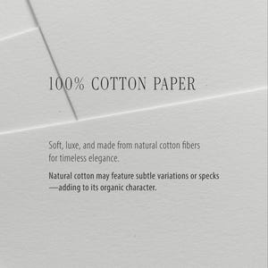 Puede incluir: Una pila de hojas de papel blanco con el texto 100% COTTON PAPER, Soft, luxe, and made from natural cotton fibers for timeless elegance. Natural cotton may feature subtle variations or specks&mdash;adding to its organic character.