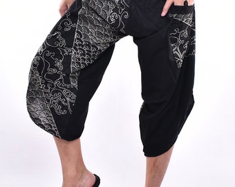 May include: Black pants with a white wave and cloud design. The pants have an elastic waistband and a loose fit.