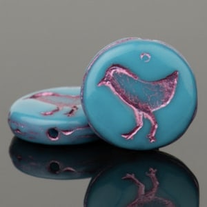 Teal opaque coin with purple birdie