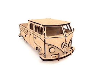 May include: A wooden model of a vintage pickup truck, featuring a classic design with a flatbed and a prominent front grille. The vehicle is constructed from light-colored wood, showcasing the natural grain and texture. The model includes detailed cutouts for windows and other features.